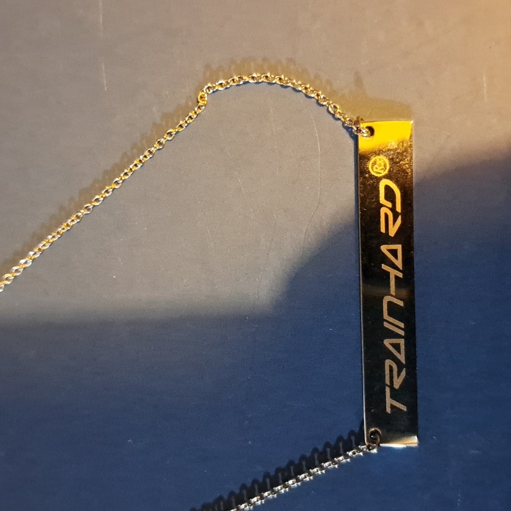Short silver tone necklace "Train Hard"